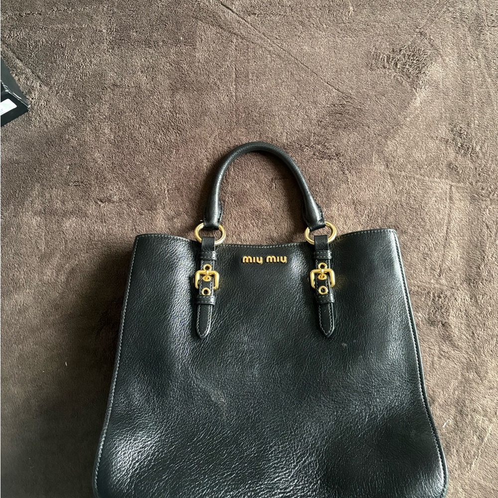 Miu Miu Black Leather Handbag with Gold Accents